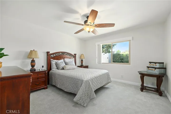 Primary bedroom with window to greenery of rear yard