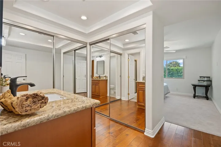 Dual Closets with mirrored doors.