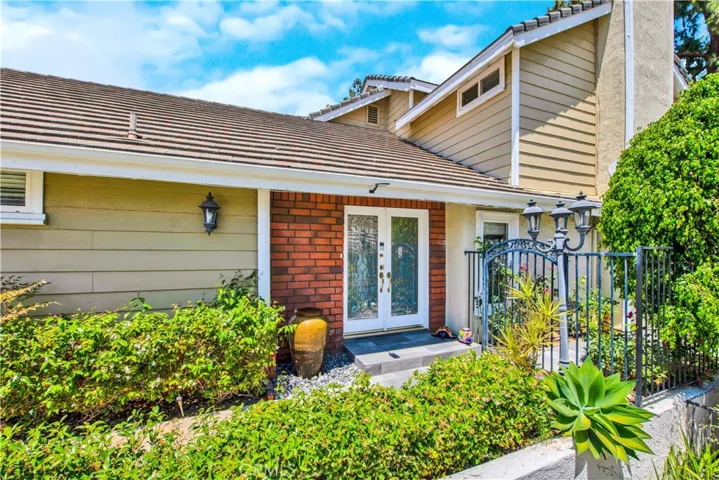 Wrought iron fence leads to backyard