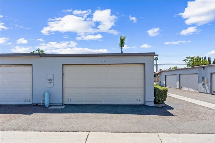 Two-car detached garage where washer/dryer is located.