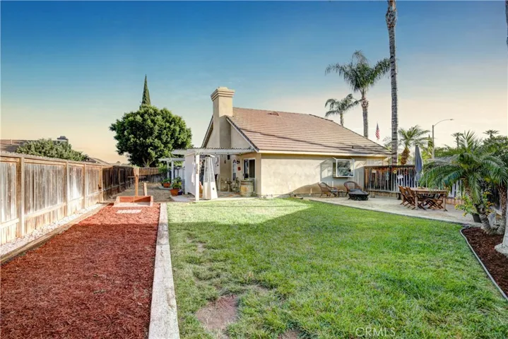 Backyard with horseshoe/cornhole