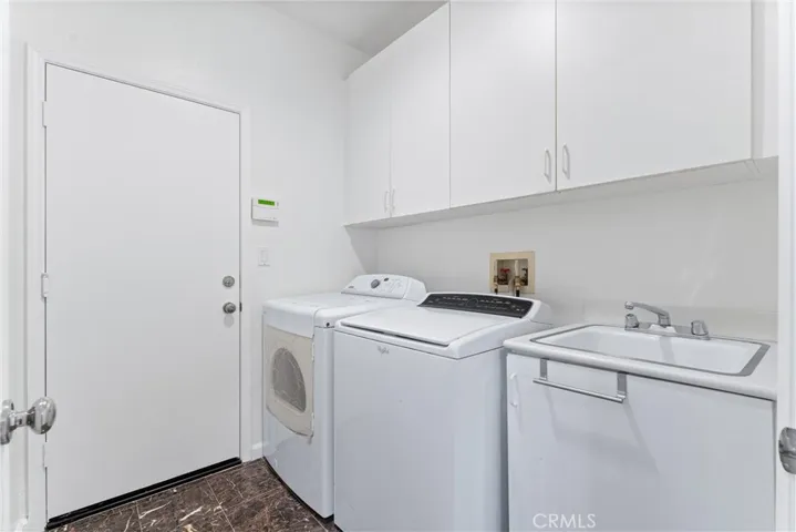 Indoor laundry, separate room. Entry to garage.