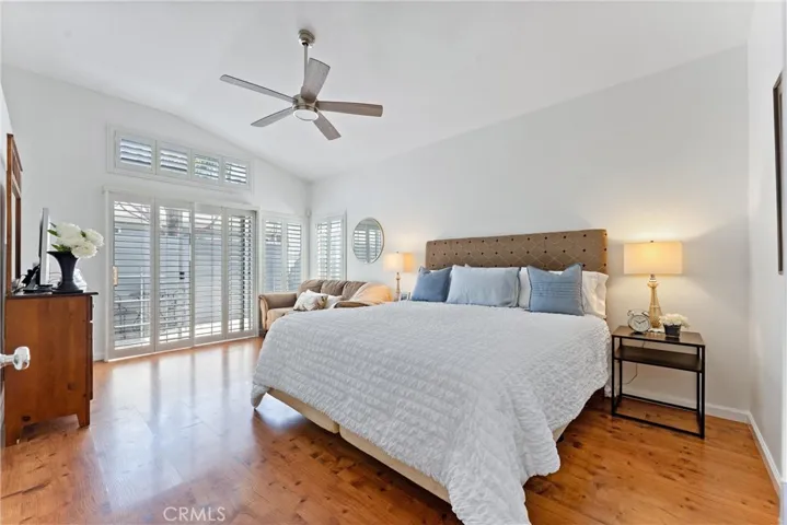 Primary bedroom with access to the side yard. Large ensuite bathroom, separate tub and shower, dual vanity.