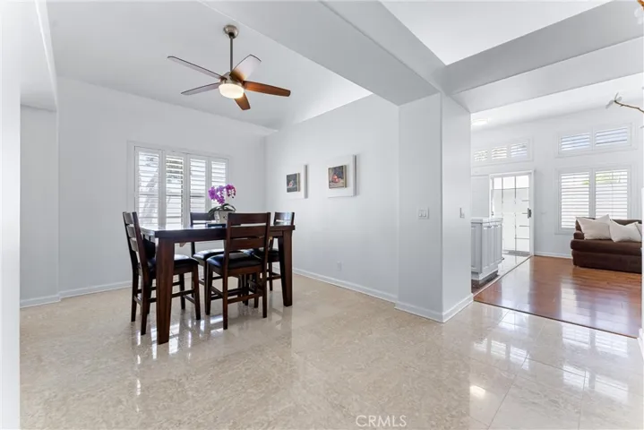 Formal dining room, showing the way to the famil room and kitchen.