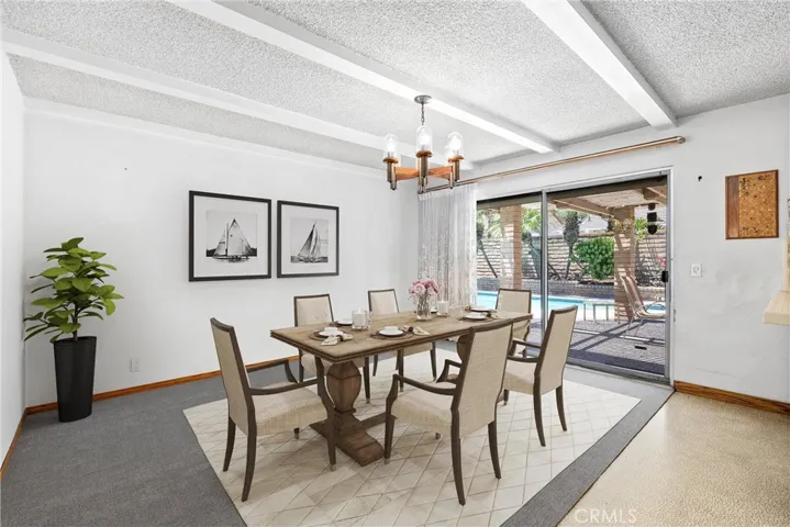 Virtually Staged Dining Room with slider to backyard