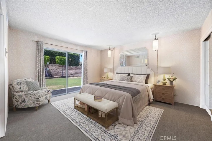 Virtually Staged Main Floor Master Bedroom with Slider to backyard