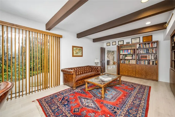 Library/Office/Den with beams and sliding door