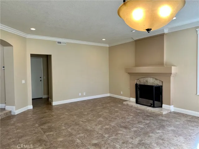 Large family room with a cozy fireplace.