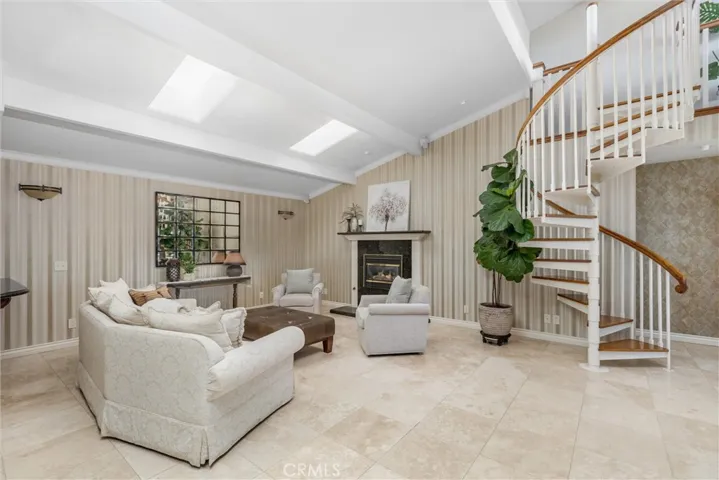 Travertine flooring and lots of light create a blank canvas for you to create your dream living space.