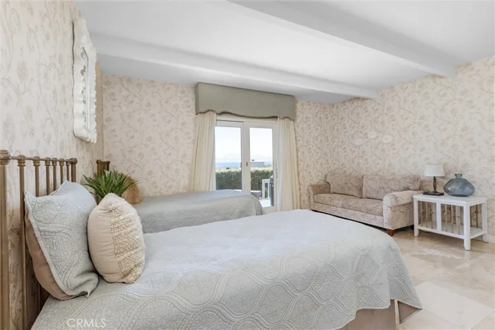 The lower level suite could absolutely be a primary space. With ensuite bathroom and glass door to the views and beautiful backyard make this a special room.