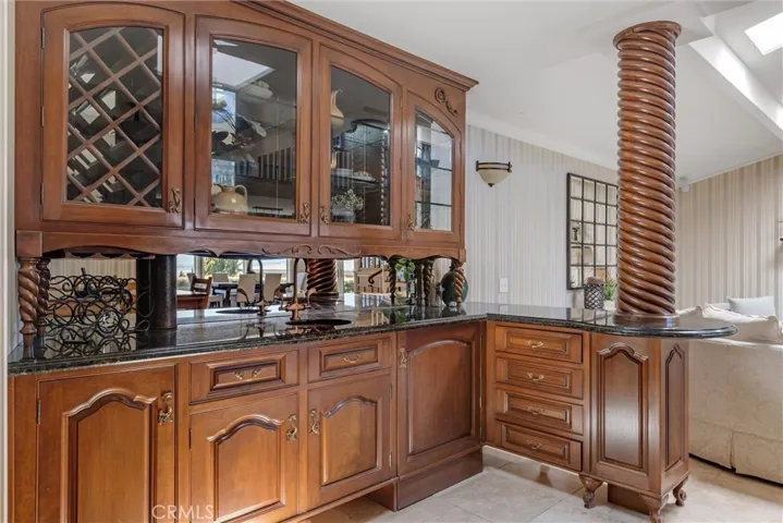 Custom Cabinetry wet bar compliments the family - living space. Perfect for entertaining and time for a beverage.