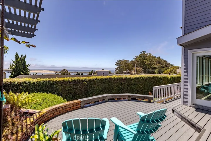 Entertainer's backyard with coveted ocean views, a low maintenance Trex deck and mature landscaping.