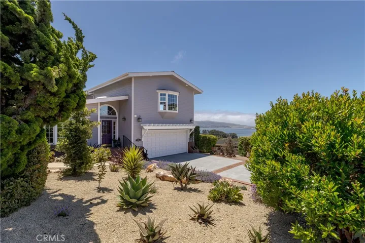 This hilltop home boasts expansive views, mature, gorgeous landscaping and all the amenities!!