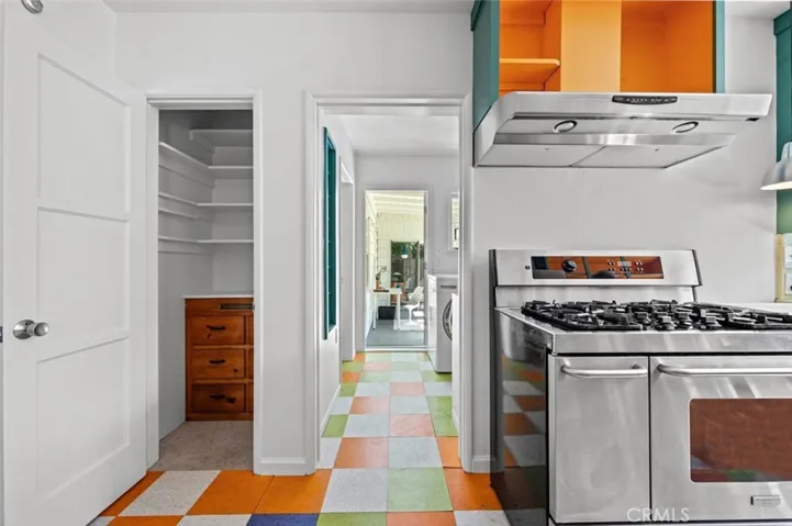 Looking through the laundry room to an enclosed patio.