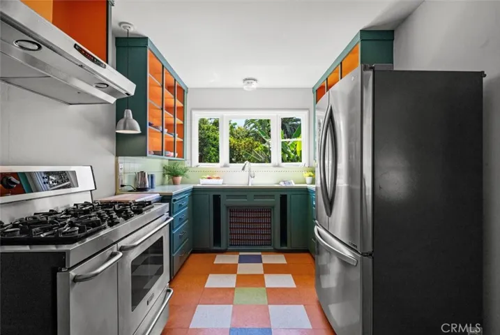 Colorful vintage kitchen with open shelves.