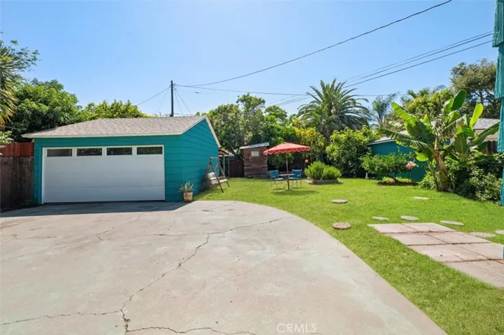 Big backyard with drive/open patio.
