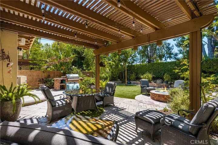 a shade cover makes for a comfortable, outdoor entertainment area