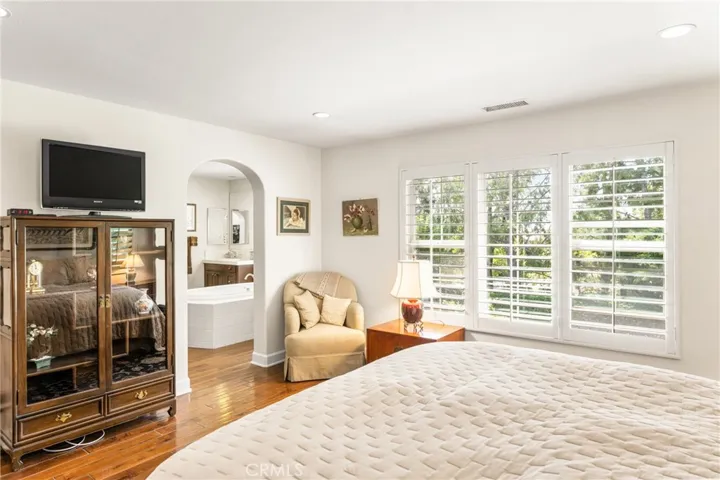 step into a spacious primary bathroom
