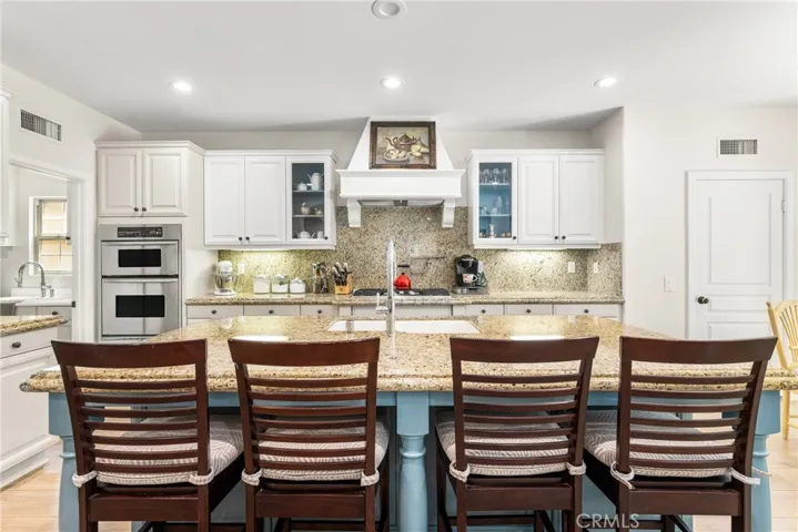 a new kitchen, with a full-height granite backsplash