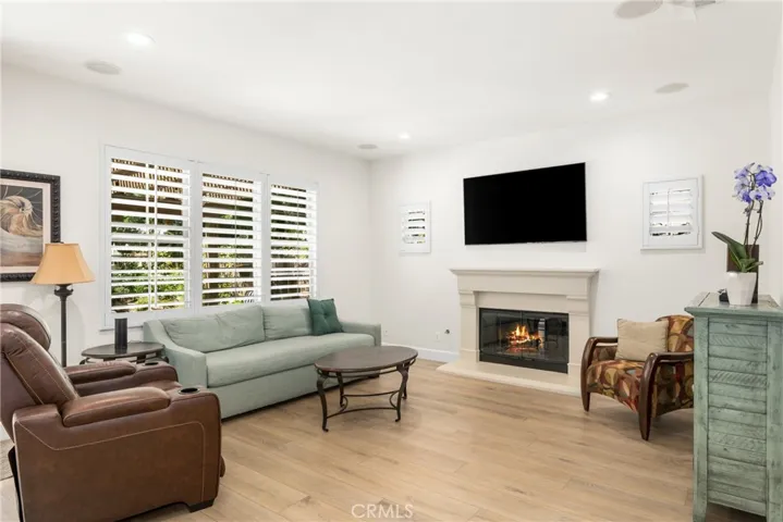 gather by the fire, with a view of the lush yard