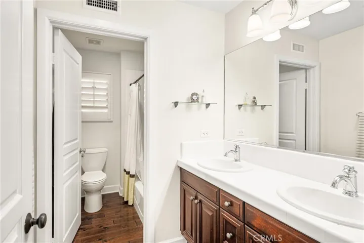 dual vanities featured in the upstairs guest bathroom