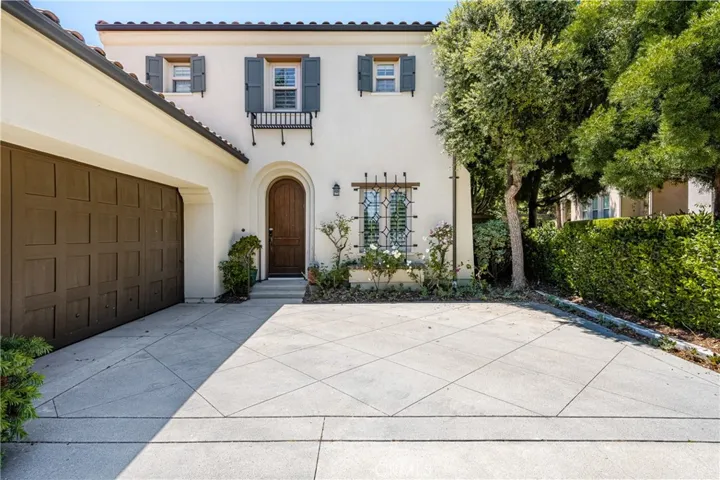 featuring an oversized driveway