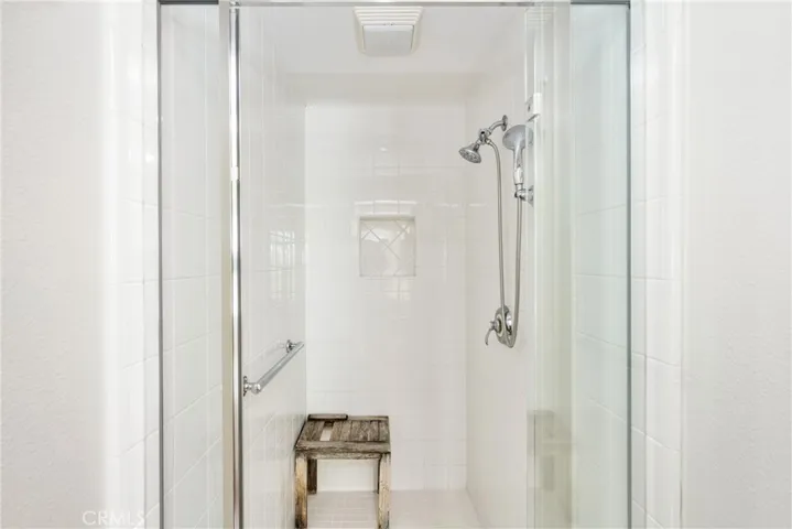 featuring a deep tub and walk-in shower