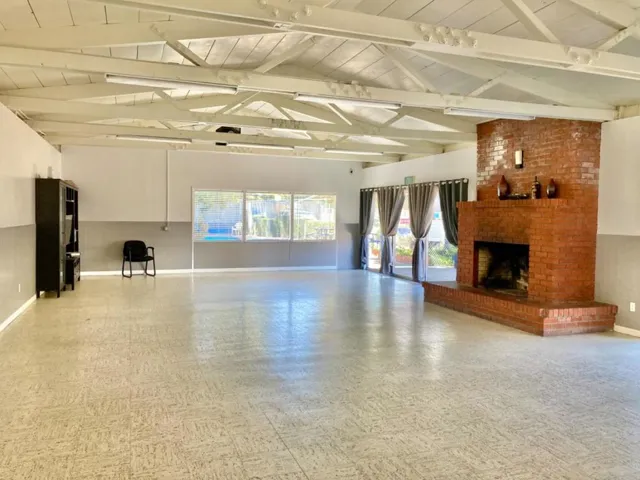 This side of the clubhouse views out to the community pool. Clubhouse has small kitchen. The interio