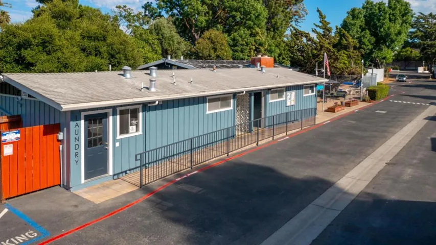 The new improved community building that is a coin op laundry facility, public restrooms and office