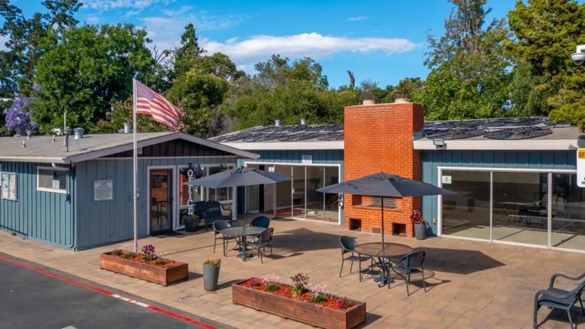 The new community buildings with the BBQ and seating area is freshly painted in handsome colors