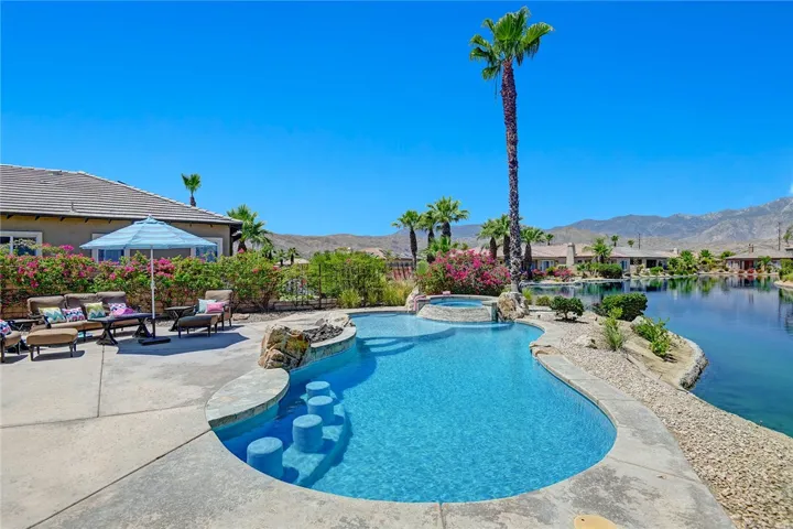 Pool, lake, and mountain views from 3/4 of the home and yard.