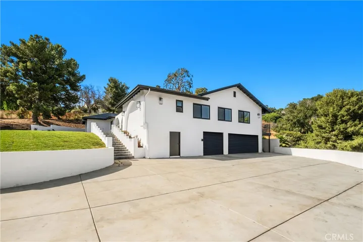 Garage doors were virtually added in this photo.