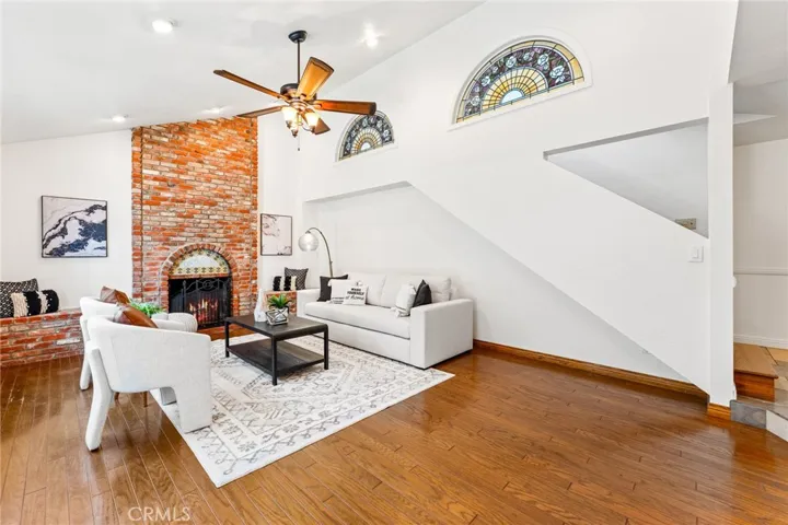 Another View of the Living Room with Beveled Glass and Hardwood Flooring