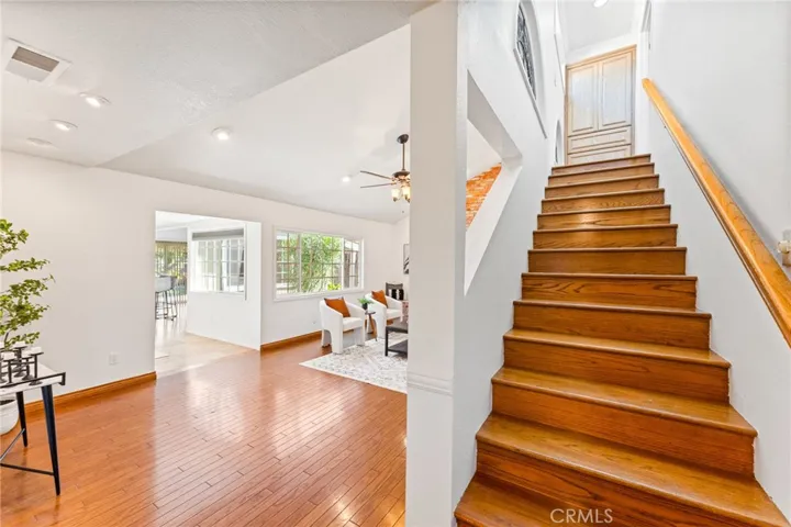 Entrance to the Extra Large Formal Living Room with Soaring Vaulted Ceilings, Hardwood Flooring, Recessed Lighting