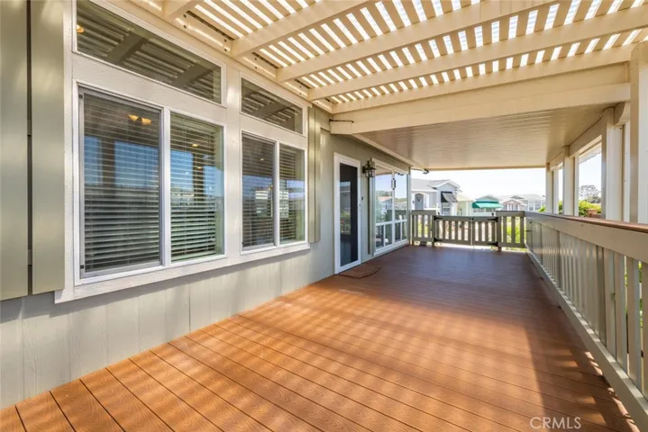 Covered front Patio/Porch with both lattice and solid covers. Nicely appointed composite simulated wood decking installed through the entire area.