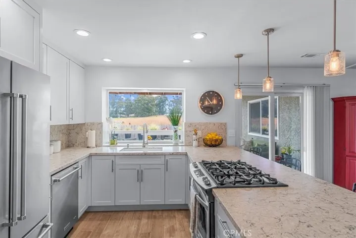 Stone counters, stainless appliances.
