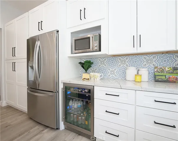 Fridge + Bev Fridge and Microwave. Large Pantry on Left Side