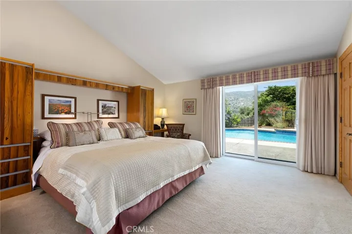 Primary Bedroom with slider to pool