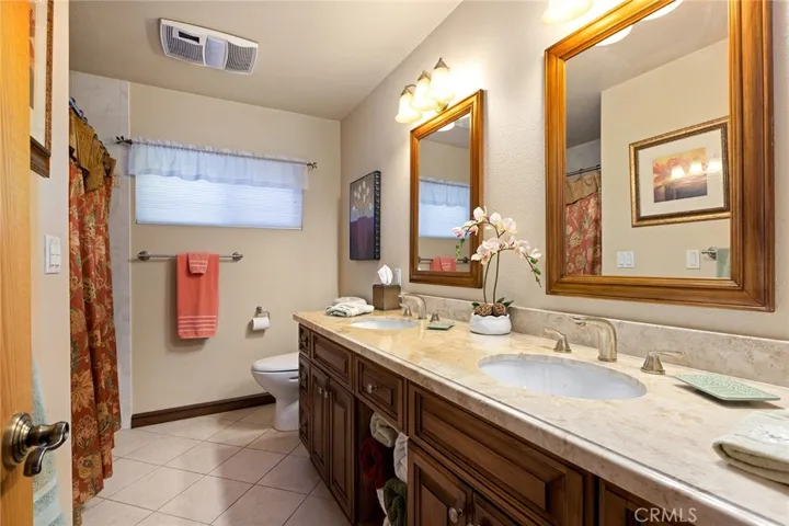 Hall Bath with dual sinks, tub and shower