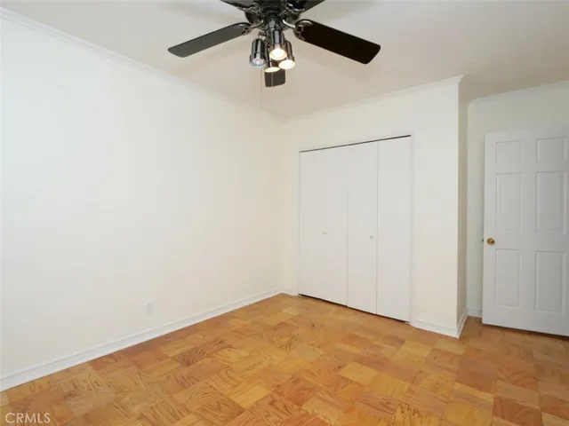Bedroom 3 showing refinished floors, ceiling fan and freshly painted room