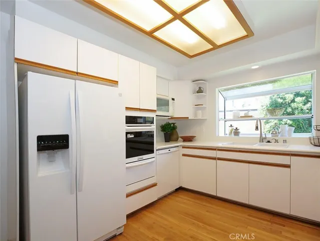 Another view of the kitchen with its garden window and new oven.