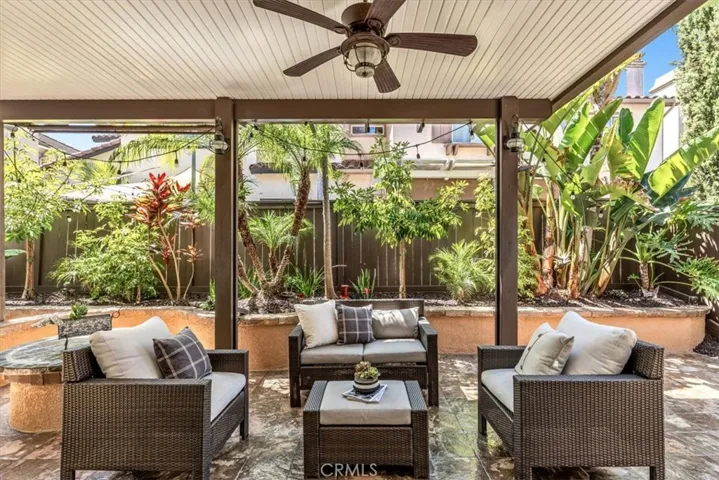 Welcome to your backyard tropical paradise boasting Alumawood patio cover with lighting & ceiling fan.