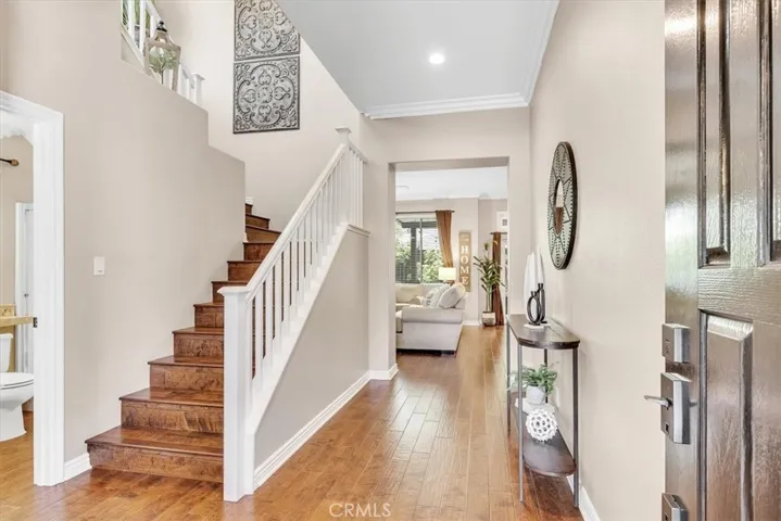 Step inside this home to appreciate the open concept layout with an abundance of (new vinyl) windows for natural light, warm hardwood flooring, and tall ceilings.