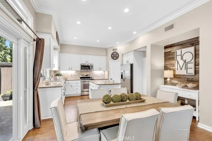 The custom barn wood niche is nestled between the kitchen & dining space.