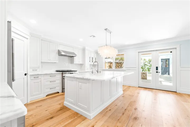 Custom kitchen with pass-through windows to covered patio.