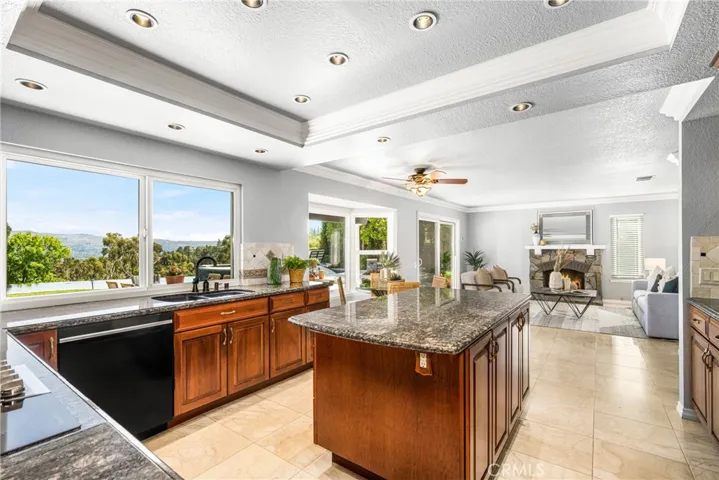 The kitchen opens to the great room, including a casual dining area and gorgeous fireplac.