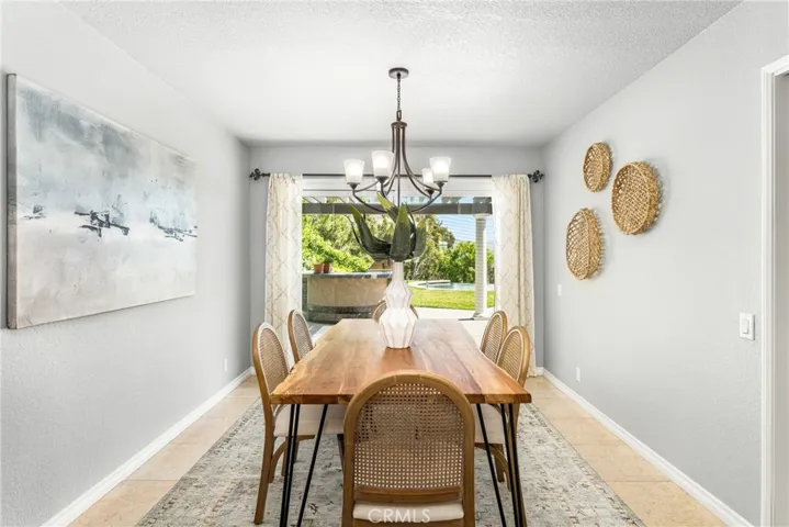 The formal dining room features a sliding glass door to the patio and a fabulous view.