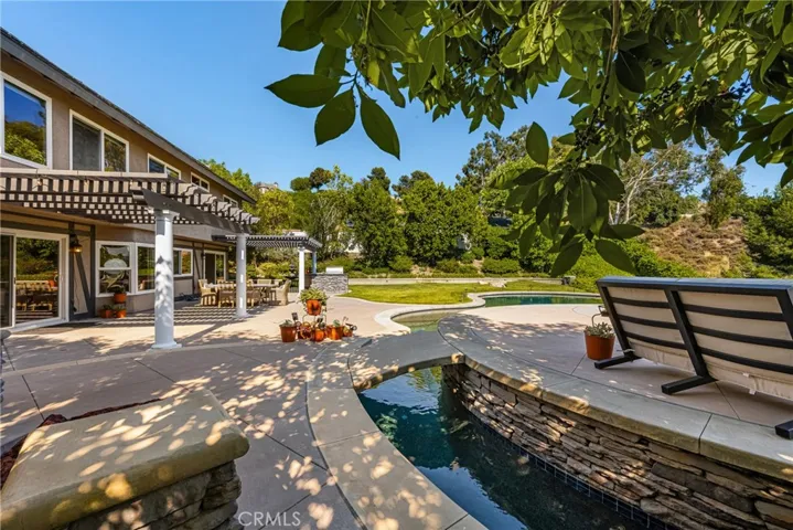 Mature trees surround the home, giving plenty of privacy and afternoon shade.