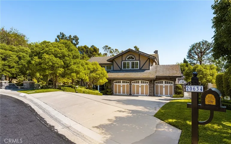 Welcome to 20634 Circulo Loma, a stunning Tudor on a cul-de-sac in Travis Ranch. The oversized three car garage also features a workbench, storage and a Level 2 EV charger.