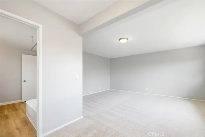 Primary bedroom with direct access to hallway bathroom.